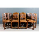 A set of eight 1930's oak dining chairs by Robert Thompson of Kilburn (1876-1955), (including two