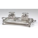 A late Victorian silver rectangular two-handled ink stand with gadroon mounts, reeded handles and on