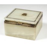 A George V white onyx and silver gilt mounted rectangular cigarette box, the lid inlaid with blue