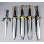 Four modern large fantasy daggers, each with double edged 12ins bright steel blade, brass cross