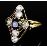 An early 20th Century 18ct white and yellow mounted sapphire and diamond ring, the face set with