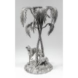 A late Victorian plated centrepiece modelled as two greyhounds standing a rocky base beneath a