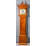 An 18th Century oak longcase clock by John Day of Wakefield, the 12ins square brass dial with wide