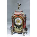 An early 18th Century French red tortoiseshell and Boulle mantel clock of Louis XIV design with 19th