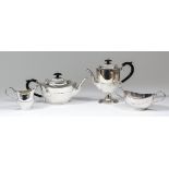 An Elizabeth II silver oval four piece tea and coffee service produced for the J.P. McManus