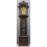 A late 19th Century "Black Oak" longcase clock, the 12ins arched brass dial with silvered chapter