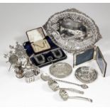 A late Victorian silver oval dish, the pierced rim cast with floral leaf and scroll ornament, 11.