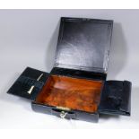 A Victorian leather writing box by Wells & Lambe, with stamped line and foliage decoration, the