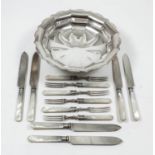 Six George V plated and mother-of-pearl handled fruit knives and forks with silver ferrules,