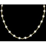 A modern 18ct gold and cultured pearl single strand necklace with thirty cultured pearls