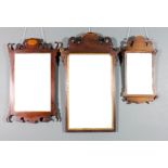 A 19th Century mahogany framed rectangular wall mirror with shaped cresting and gilt inner slip,