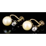 A pair of gold and silvery metal mounted pearl and diamond earrings (with screw fittings), the