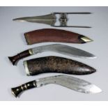 A 20th Century kukri with 11.75ins steel blade, in tooled leather covered wooden sheath with two