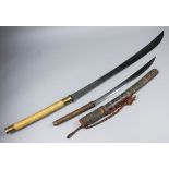 A 20th Century Burmese sabre, 28ins single edge blued blade, grass bound double handed grip with