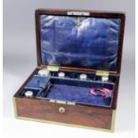 A lady's early 19th Century brass bound rosewood toilet box, the interior with glass and silvery