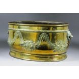 A late 19th/early 20th Century Dutch brass oval two-handled jardiniere, the sides with repousse