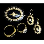 A late Victorian gold coloured metal black enamel and seed pearl set mourning suite, comprising an