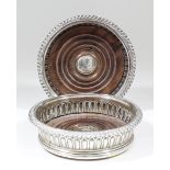 A pair of late George III silver circular coasters with gadroon mounts and part reeded bodies,