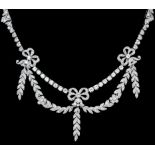 A silvery coloured metal mounted all diamond set necklace in the Edwardian manner, the diamond set