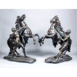 A pair of 20th Century green/brown patinated bronze figures of Mail horses after Guillaume