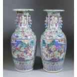 A pair of large Chinese "Cantonese" porcelain two-handled vases enamelled in colours and gilt with