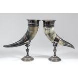 A pair of late Victorian plated mounted horn vases, the stems and circular foots with repousse