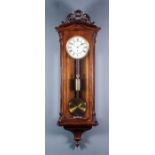 A late 19th Century oak cased "Vienna Regulator" by Camerer Cuss & Co, 56 New Oxford Street, London,