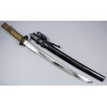 A Japanese Wakazashi short sword, 17ins blade in old polish and displaying an active hamon (active