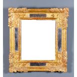A late 18th/early 19th Century Continental gilt-framed rectangular wall mirror with plain mirror