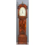 A 19th Century figured mahogany longcase clock by Burton of Eastry, the 12ins arched painted dial