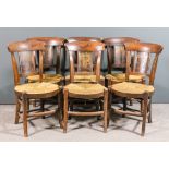 A harlequin set of six 19th Century Continental stained wood and rush seated kitchen chairs with