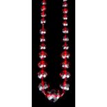 A late Victorian single strand of graduated faceted red amber beads, the eighty nine beads ranging