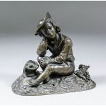 19th Century Continental school - Bronze figure of a seated boy, his right hand supporting his