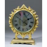 An early 20th Century "Mystery" night timepiece, the 6ins diameter frosted glass dial with Roman