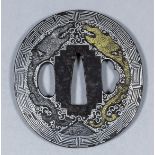 A fine Japanese iron tsuba, the plate decorated in gold and silver with two dragons chasing the