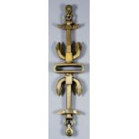 A cast bronze adorsed anchor pattern rail with rectangular slot to centre, 20ins x 4.5ins