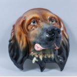 A Beswick pottery wall mask modelled as a dog, 11ins x 10.5ins (printed factory mark and impressed