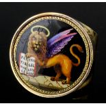 A modern 9ct gold and enamel gentlemen's ring, the face with an enamelled panel depicting the Lion