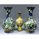 A pair of Victorian Doulton Lambeth faience baluster-shaped vases decorated by Mary Mitchell, with