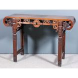 A Chinese hardwood rectangular altar table with flush panelled top and scroll ends, the front and