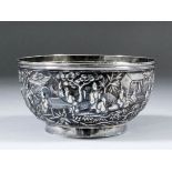 A Chinese silvery metal circular bowl cast with deities and attendants in a landscape, 4.75ins (12.