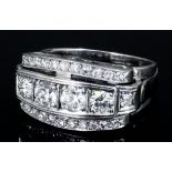 An Art Deco silvery coloured metal mounted diamond ring, the face set to the centre with seven