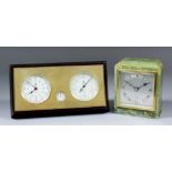 A 20th Century mahogany and brass faced desk timepiece and aneroid barometer by Rigel of