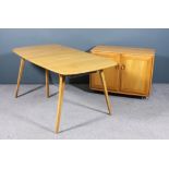 A modern Ercol elm and beech rectangular extending dining table with one extra fold-out leaf, on