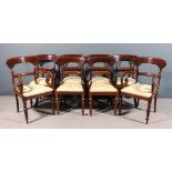 A set of eight early Victorian mahogany dining chairs (including two armchairs with scroll arms),