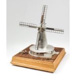 A good Elizabeth II silver model of a windmill - "The Swingate Mill, Guston 1849", 10.5ins high,