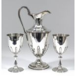 An Elizabeth II silver wine or claret jug and pair of matching goblets, the urn shaped body with