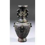 A Chinese patinated bronze two-handled vase in the "Archaistic" style with serpent pattern