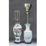 A Chinese porcelain two-handled vase enamelled with a seated figure in a garden with attendants, and