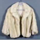 A lady's pale blonde mink bolero jacket retailed by Harrods, size 10-12, length 22ins